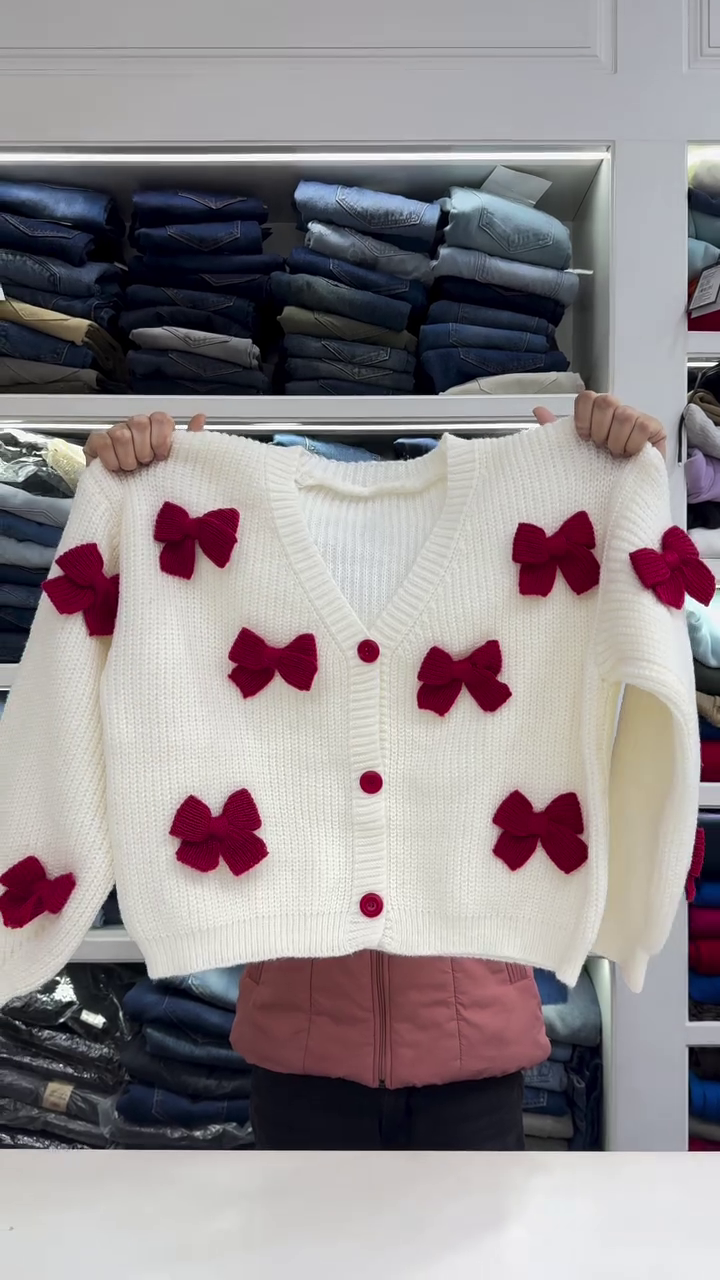Chic White Knit Cardigan with Bold Red Bow Accents - Image 5