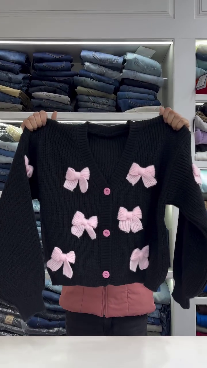 Chic White Knit Cardigan with Bold Red Bow Accents - Image 4